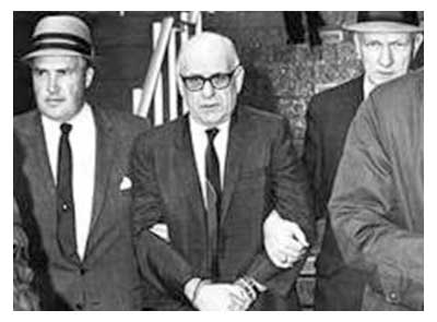 A rare photo of FBI agents H.Paul Rico (left) and<br/>
Dennis Condon (right) bringing in a crime suspect.